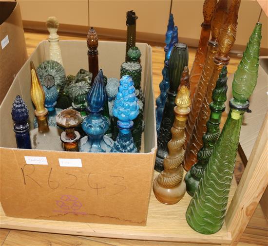An extensive collection of 1950s coloured glass decanters
